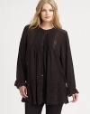 Beyond beautiful, an airy tunic featuring classic eyelet and pretty embroidery. Simply wear it with skinny pants or leggings. Round neckLong sleevesButton frontEyelet/scalloped trimPull-on styleHi-lo hemAbout 32 from shoulder to hemRayonMachine washImported