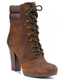 Lace-up booties in distressed leather with high stacked heels and bold hardware add up to tough downtown style. By Enzo Angiolini.