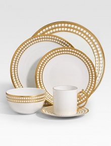 A beautiful dessert plate in fine Limoges porcelain, made entirely by hand and finished with individually-applied 14k gold along the pearl border. From the Perlee Gold Collection Porcelain 8¾ diam. Dishwasher safe Imported 