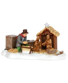 A calming hush falls upon this scene as a festively dressed man lovingly and tenderly prepares the manger of his New England village's nativity. This porcelain figurine captures the anticipation, excitement and reverence of the holiday season.