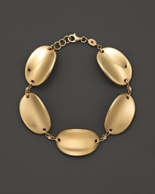 Convex discs of 18K yellow gold. By Roberto Coin.