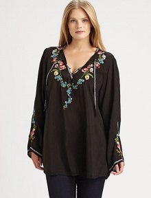 Embroidered flowers adorn this flowing top with self ties at its decolletage-flattering neckline. Ties at split neckPull-on styleEmbroidered detailsPull-on styleCurved hemAbout 32 from shoulder to hemRayonMachine washImported