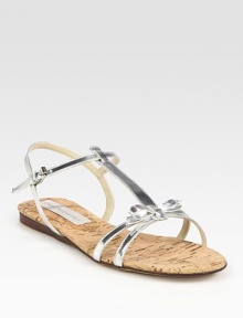 Shimmering metallic t-strap with a secure, adjustable slingback strap, topped with a sweet bow detail. Faux metallic leather upperPadded insoleImportedOUR FIT MODEL RECOMMENDS ordering one half size down as this style runs large. 