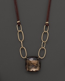 Hammer faceted cushion cut smoky quartz adds rich sparkle to leather and links of 14K yellow gold. By Nancy B.