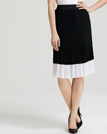 Sophisticated shades of black and white toughen a delicately pleated Bloomingdale's Exclusive BASLER skirt. Style with a utility shirt for modern femininity.