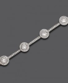 Delicate crystal accents are punctuated by gleaming round-cut cubic zirconia accents on this gorgeous silvertone mixed metal bracelet by Eliot Danori. Approximate length: 7 inches.