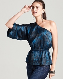 Dress up your denim with this French Connection one-shoulder top, finished with a lustrous sheen and unique leaf print. Statement earrings and bold bangles complete the look with glam for a fashion-savvy night on the town.