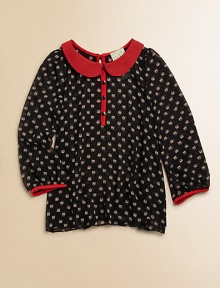 A little birdie told her about this adorable, lightweight, owl-printed blouse with contrasting trim and Peter Pan collar.Peter Pan collarLong sleeves with contrasting cuffsButton-front and backPolyesterDry cleanMade in the USA of imported fabric