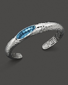 Blue topaz set in sculpted sterling silver. By Roberto Coin.