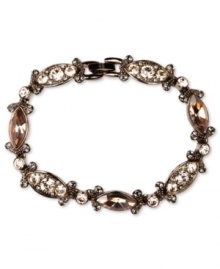 Refresh your look. Givenchy's alluring flex bracelet features silk Swarovski stones. Set in brown gold tone mixed metal. Approximate length: 7-1/4 inches.