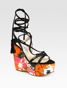 Vibrant, floral-print wedge with leather straps and braided suede laces that make their way up the ankle, concluding with tassels. Self-covered wedge, 5 (125mm)Covered platform, 2 (50mm)Compares to a 3 heel (75mm)Leather and suede upperLeather lining and solePadded insoleMade in ItalyOUR FIT MODEL RECOMMENDS ordering true size. 