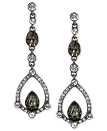 Glistening touches add glamour to these earrings from Givenchy. Crafted from hematite-tone mixed metal, the pair features clear and dark green glass crystal stones for a stunning effect. Approximate drop: 6-1/5 inches.