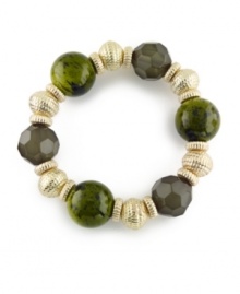 A gorgeous shade of deep green intensifies the design of Charter Club's beaded bracelet. With an assortment of faceted and smooth plastic beads, it's crafted in gold tone mixed metal. Approximate diameter: 2 inches.