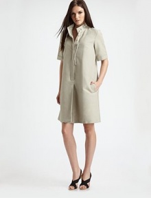 Lightweight linen/cotton canvas from Italy in an effortless day dress with a subtle flared shape.Stand collar with laced tieShort cuffed sleevesHidden button half placketAngled front pocketsGently flared shapeFully linedAbout 37 from shoulder to hem51% linen/49% cottonDry cleanImported of Italian fabric Model shown is 5'10 (177cm) wearing US size 4. 