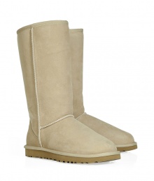 A tried-and-true cold weather staple, these tall classic shearling boots from UGG Australia boast comfort and utilitarian chic - Round toe, rugged rubber sole, exposed seams, cozy shearling lining, back logo detail, mid-shaft length - Pair with skinny jeans, an oversized cashmere sweater, and a down jacket or wool cape