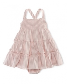 A charming smocked sundress is rendered in striped cotton jersey and finished with a ruffled hem.