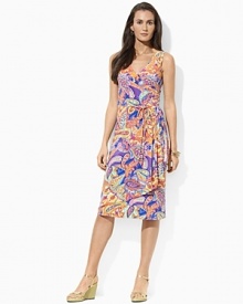 Smooth paisley jersey flatters the body in a feminine A-line silhouette with an elegant cross-wrap neckline.