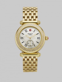 A stunning mother of pearl dial surrounded by a dazzling diamond bezel.Swiss quartz movement Water resistant to 5 ATM Diamond bezel, 0.58 tcw Goldplated stainless steel round case, 37mm, (1.46) Mineral crystal Mother of pearl dial Roman numeral hour markers Second dub-dial Stainless link bracelet, 18mm, (.71) Imported 