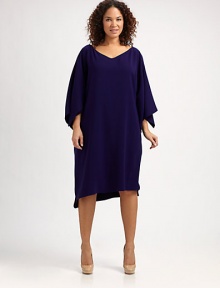 There's no need to sacrifice style for comfort when you wear this pull-on dress with a relaxed fit and feminine silhouette.V-neckFlutter sleevesPull-on styleFully linedAbout 25 from natural waistPolyesterDry cleanImported