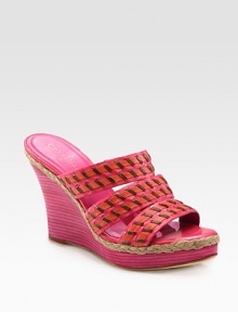 Chunky stacked wedge with braided espadrille trim and tastefully textured straps. Stacked wedge, 4 (100mm)Covered platform, 1 (25mm)Compares to a 3 heel (75mm)Leather upperLeather lining and solePadded insoleImported