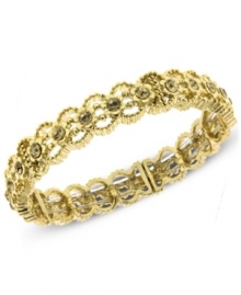 A lovely Victorian-inspired design by 2028. This stretch bracelet features shimmering glass crystal accents in an intricate setting. Crafted in gold tone mixed metal. Stretches to fit wrist. Approximate length: 7 inches.