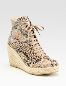 Classic ankle-grazing silhouette modernized by a snake-print faux leather upper, lace-up front and an espadrille wedge. Braided hemp wedge, 4 (100mm)Braided hemp platform, 1 (25mm)Compares to a 3 heel (75mm)Snake-print faux leather and burlap upperRubber solePadded insoleMade in SpainOUR FIT MODEL RECOMMENDS ordering true whole size; ½ sizes should order the next whole size up. 