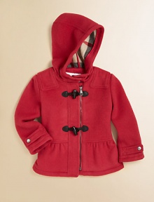 An ultra-toasty wool coat with toggle buttons, attached hood, check lining and pretty peplum hem for your little snow bunny.Attached hood with button closureShoulder patchesLong sleeves with snap cuffsFront zip with toggle buttonsPeplum hemFully linedWoolDry cleanImported