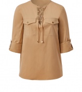 Safari-chic inspired and easy to style, this lace-up front top from Michael Kors is an elegant staple for off-duty or casual day-to-night style - Lace-up front, three-quarter sleeve with rolled button tab detail, chest flap pockets with buttons, back yoke with gather detail - Relaxed silhouette - Wear with sleek trousers or skinny jeans and platform heels