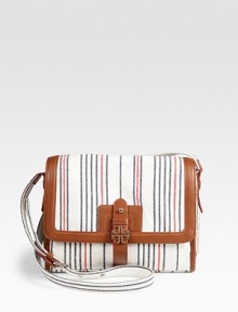 Bright vertical stripes adorn this soft nautical-inspired design, trimmed in ultra-rich contrasting leather. Adjustable shoulder strap, 17-20½ dropLeather flap top closureOne outside open pocketOne inside zip pocketTwo inside open pocketsLogo-printed canvas lining10¼W X 8½H X 3DImported