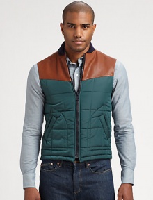 Casual vest adds a layer of warmth and style in this modern combo of leather and nylon.Front zipperSide pocketsLeather shouldersAbout 24 from shoulder to hemPolyamide/polyesterDry clean by leather specialistMade in Italy