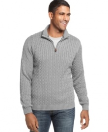 The heritage cable-knit design of this classic quarter-zip sweater from Izod lends instant polish to any casual combo. (Clearance)