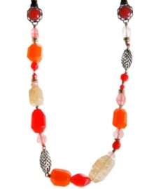 Add a unique element to your look. Semi-precious stones, glass, and plastic beads in vibrant, red and neutral hues are strung from a cow leather chain in Lucky Brand's showstopping style. Accent beads crafted in silver tone mixed metal. Approximate length: 20 inches.