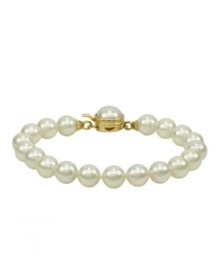 Elegance is a lustrous string of pearls. Majorica's bracelet of white organic man-made pearls (8 mm) features an 18k gold over sterling silver push-lock clasp. Approximate length: 7 inches.