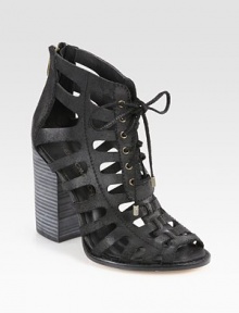 Lace-up leather basic with a downtown attitude, this ankle-grazing design has a chunky stacked heel, edgy cutouts and an exposed back zipper. Stacked heel, 4 (100mm)Leather upperBack zipperLeather lining and solePadded insoleImportedOUR FIT MODEL RECOMMENDS ordering true size. 