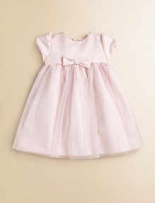 A dazzling design featuring short puff sleeves, a center bow and full, glittery skirt for precious moments.JewelneckShort puff sleevesBack buttonsGathered waist with bowFull skirtPolyester tulleDry cleanImported Please note: Number of buttons may vary depending on size ordered. 