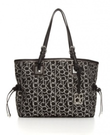 Signature style: Logo jacquard fabric makes this refined tote purse unmistakably Calvin Klein.