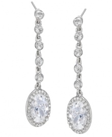 Stunning sparklers! Combining an oval shape with a linear silhouette, Carolee's dazzling crystal drop earrings are a fabulous finishing touch for your evening ensemble. Set in silver tone mixed metal. Approximate drop: 2-1/4 inches.