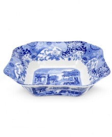 A charming rendition of the Italian countryside, the Blue Italian pattern is a beloved classic in tableware. This beautiful serving bowl features the famous blue and white design framed by an Imari border, inspired by Chinese porcelain.