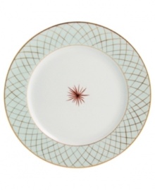 An intricate gold lattice pattern frames a single starburst in the center of the striking Etoiles dinner plates from Bernardaud.