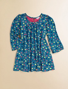 Mod-inspired polka dot frock with back zipper for easy on and off.Gathered scoopneckLong sleevesBack zipperFlared hemRayonMachine washImported