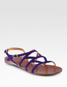 Strappy suede essential with a rubber sole and an adjustable ankle strap. Suede upperLeather liningRubber solePadded insoleMade in SpainOUR FIT MODEL RECOMMENDS ordering one half size up as this style runs small. 