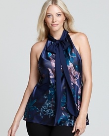 Painterly florals lend artistic inspiration to a fluid Tahari Woman Plus blouse, finished with a halter neckline for feminine allure.