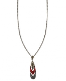 Make a colorful statement. Givenchy's necklace is crafted from hematite-tone mixed metal with a sparkling pendant of black-, red- and gold-colored crystals for a truly dazzling touch. Approximate length: 16 inches + 2-inch extender.