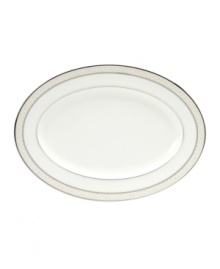 This versatile and stylish oval platter will coordinate perfectly with a variety of table linens and flatware. An ornate scroll motif trimmed in platinum adds a sophisticated sensibility to your tabletop.