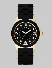 A sleek, understated timepiece with goldplated accents and wrapped stainless steel bracelet.Quartz movement Water resistant to 3 ATM Goldplated stainless steel case, 36.5mm, (1.43) Black dial with concave ring Goldplated numeral and dot hour markers Second hand Silicon wrapped stainless steel bracelet, 18mm, (.71) Imported 