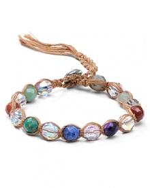 Chan Luu wraps up the boho luxe look with this leather bracelet, accented by a free-spirited mix of chunky colored crystals and multi colored stones.