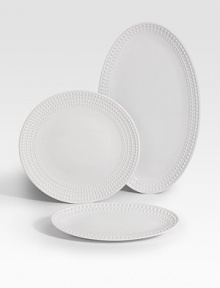 An elegantly detailed platter is made entirely by hand in fine Limoges porcelain with a raised pearl border. From the Perlee White Collection Porcelain 21 X 12½ Dishwasher safe Imported 