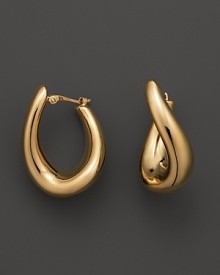 With a languid twist, a beautifully rendered hoop earring in polished 14 Kt. white gold.