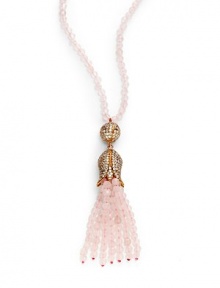 THE LOOKFeminine Metals collectionPink opal-colored beadsRhinestone ball and flower pendantPink opal-colored tassel accent14k goldplated settingNo closure; slip-on styleTHE MEASUREMENTPendant length, about 4Length, about 32ORIGINImported