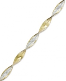 The perfect twist of two-tone metallics. Giani Bernini's versatile bracelet combines links of sterling silver and 24k gold over sterling silver. Approximate length: 7-1/2 inches.